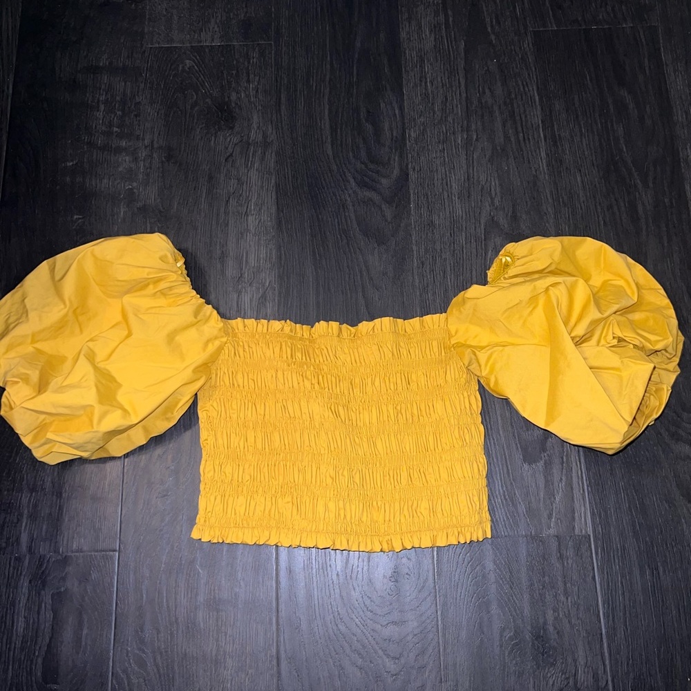 Vestique off shoulder gold cropped top with poofy sleeves with tags. Size small.